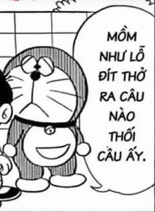 Doraemon mở túi bụng lấy bảo bối trong khi Nobita hồi hộp nhìn theo.