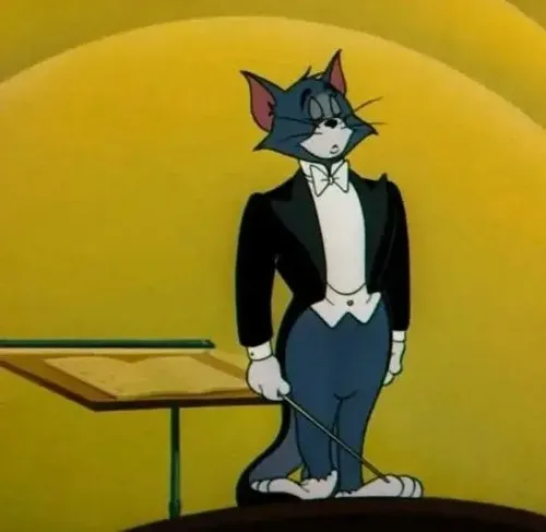 Mèo Tom mặc vest hợp để mô phỏng phong thái lịch sự có phần kiêu